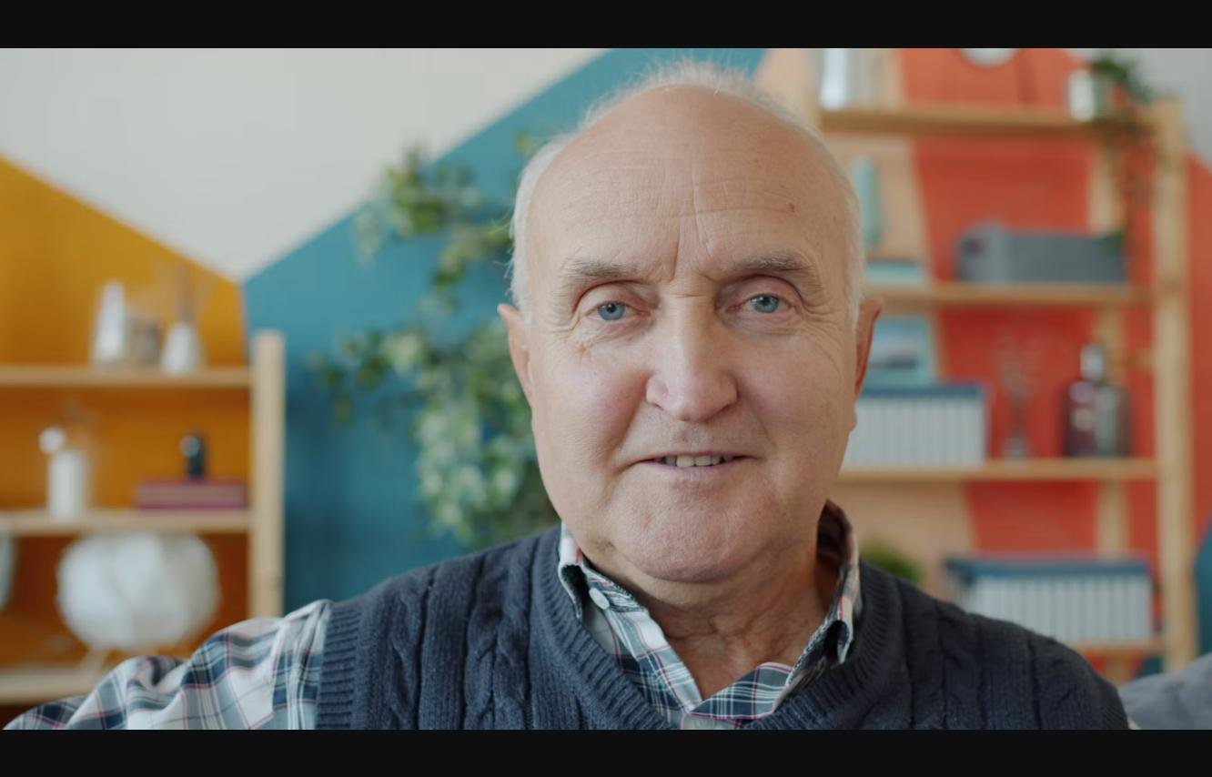 Smiling senior man at home